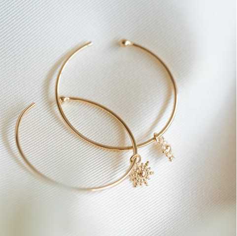 Boucles d'oreilles créoles en plaqué or soleil