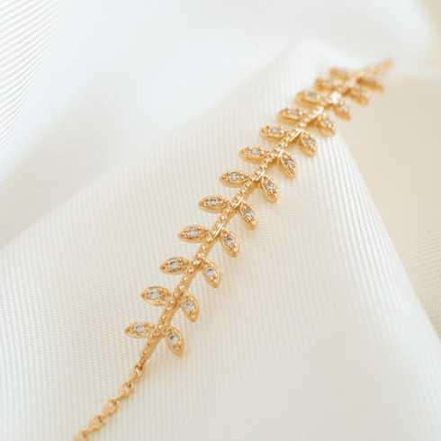 Pulsera chapada en oro con hojas de laurel