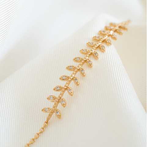 Pulsera chapada en oro con hojas de laurel