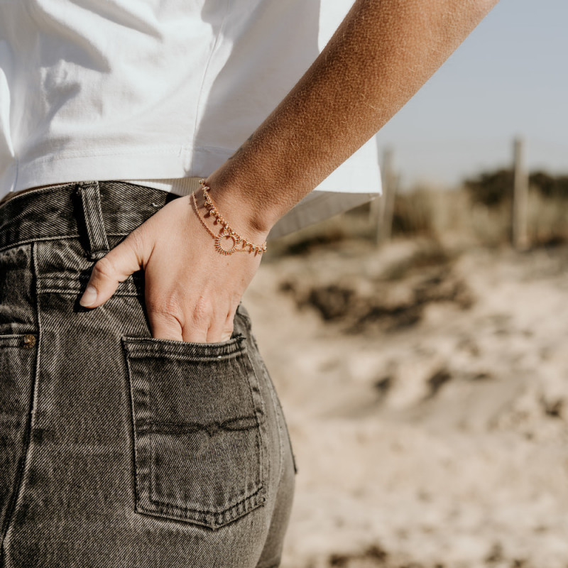 Gold-plated bracelet with sunburst charms